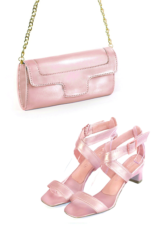 Women's powder pink luxurious elegant clutch for ceremonies, weddings and evenings out. - Worn view